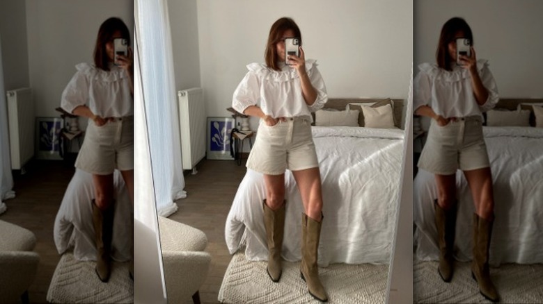 woman wearing a white cotton top and Bermuda shorts