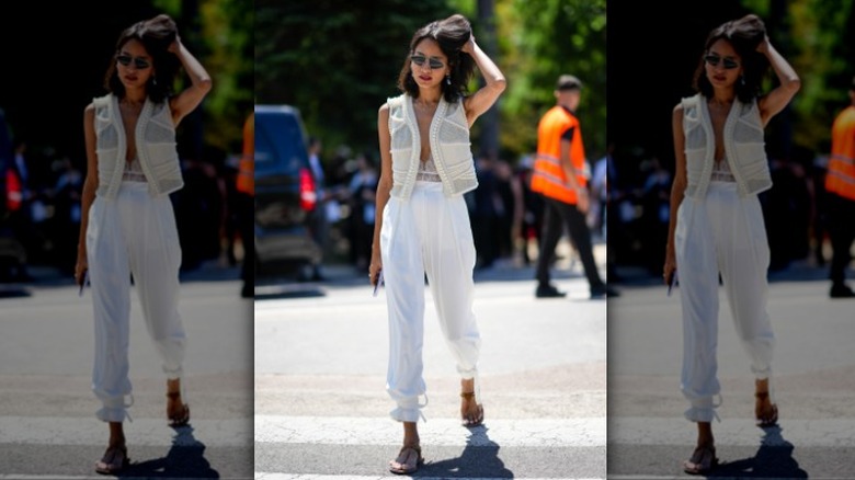 woman wearing a white vest and white bottoms