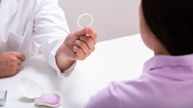 doctor showing birth control ring