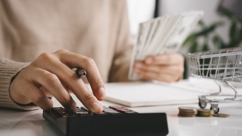Woman using a calculator