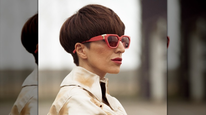 A person with a bowl cut wearing sunglasses