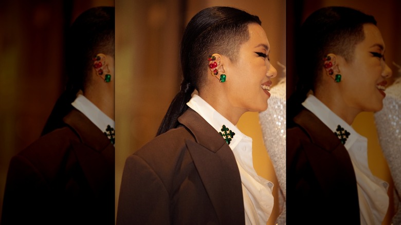 A person with an undercut and a ponytail