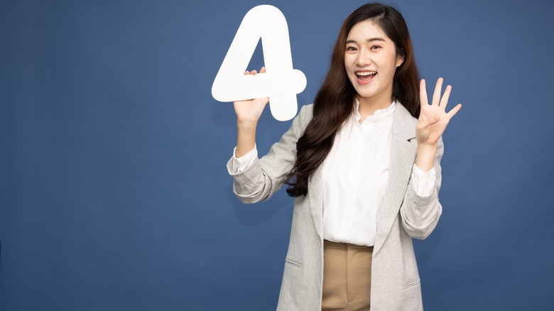 woman being productive with numerology notebook