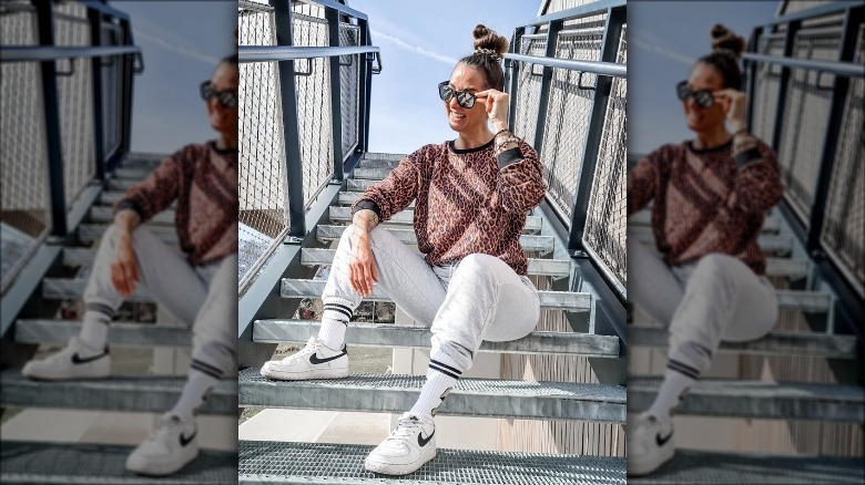 Woman in animal-print top sitting