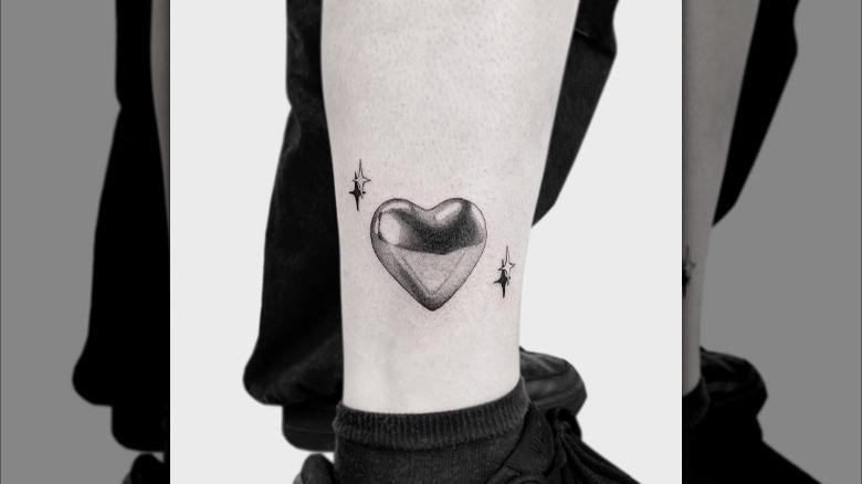 Black and gray balloon tattoo