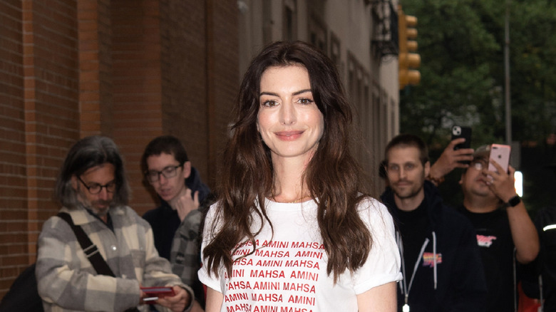 Anne Hathaway is photographed in a casual shirt outside in New York City.