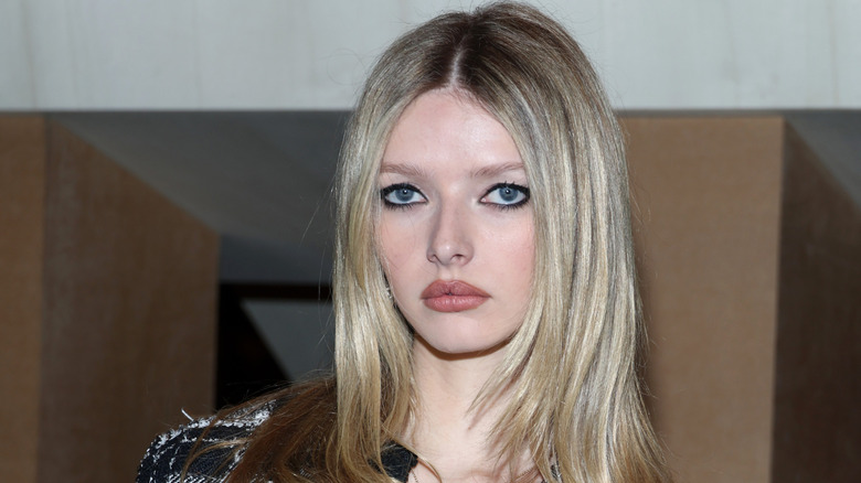 Apple Martin poses at a Chanel fashion show