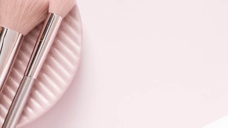 makeup brushes, sponge and powder