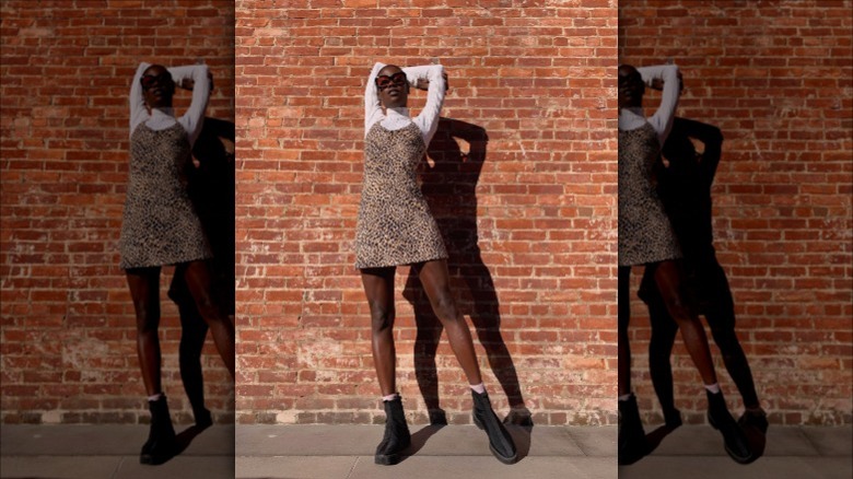 woman wearing long sleeve under dress