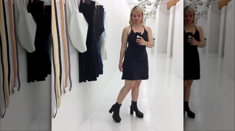 woman wearing boots and exercise dress