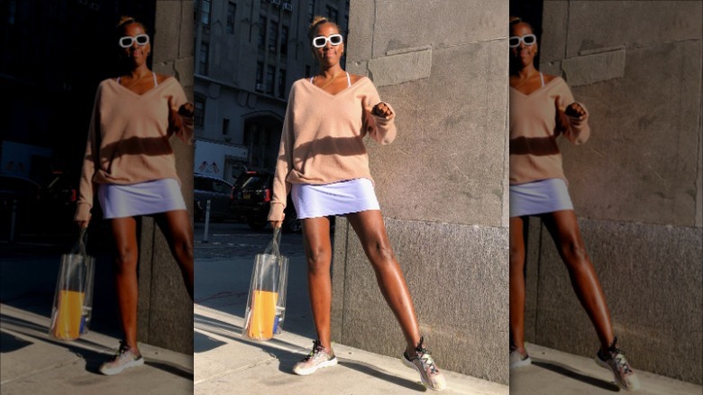 woman wearing sweater over dress