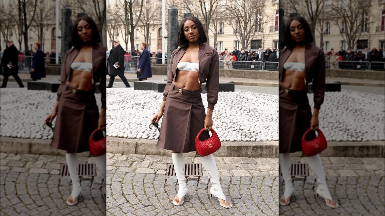 Person wearing brown neutrals with thong boots