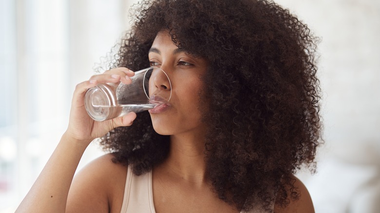 Woman drinking glass of water