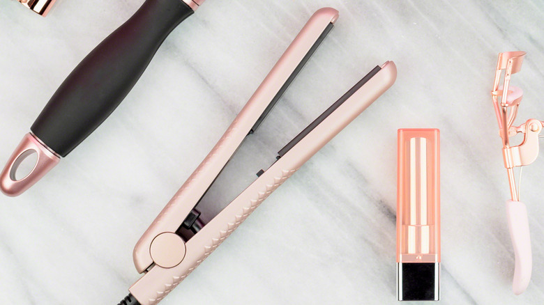 pink hair straighteners on table 