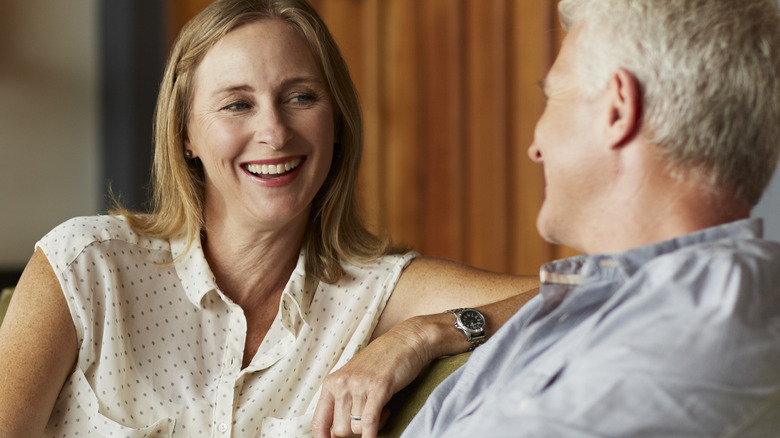 Couple talking on couch