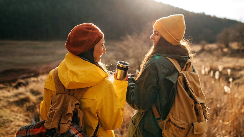 Two smiling women hiking