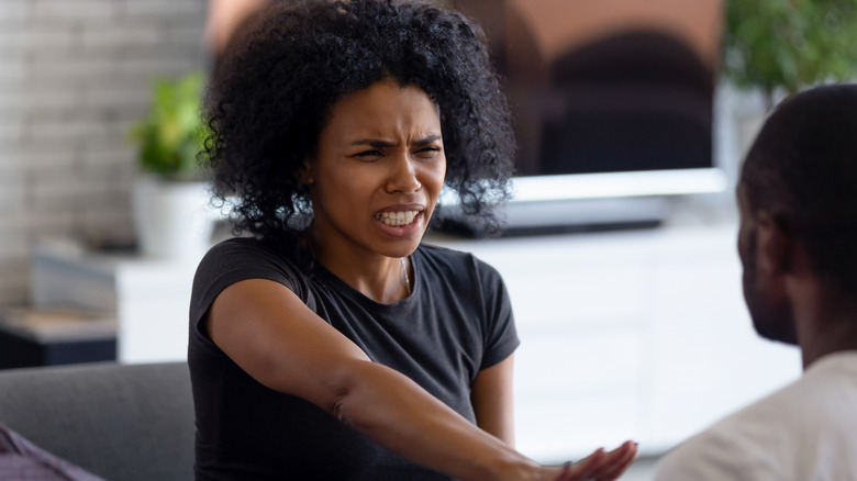 Woman holding hand out at partner