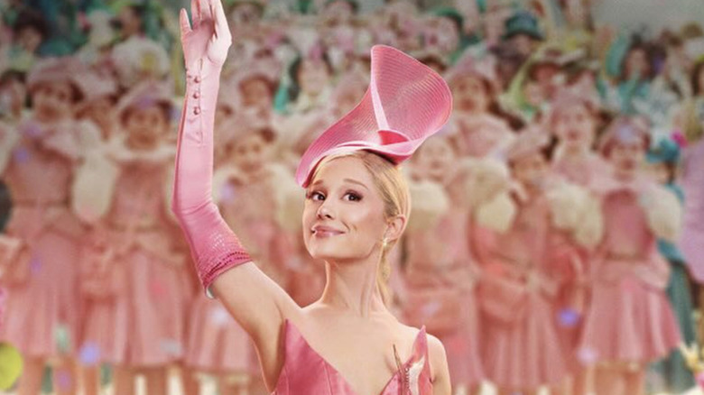 Ariana Grande wearing a pink outfit as Glinda in 