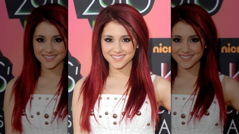 Ariana Grande posing with cherry-red hair