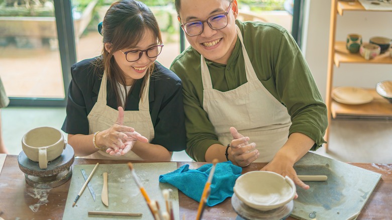 Man and woman on pottery date