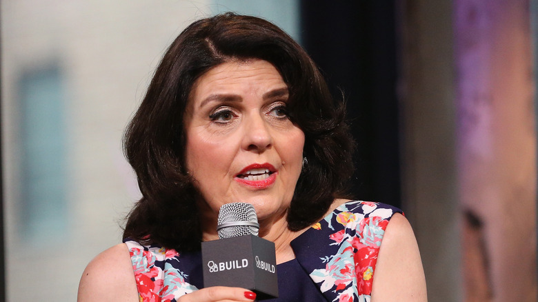 Susan Miller speaking into microphone