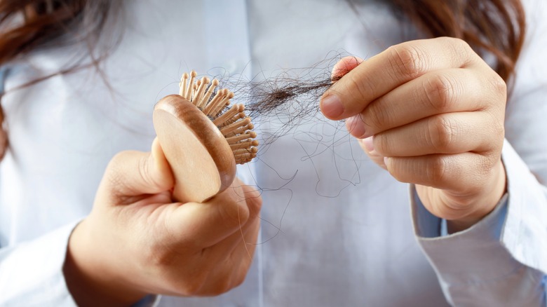 woman using hair brush