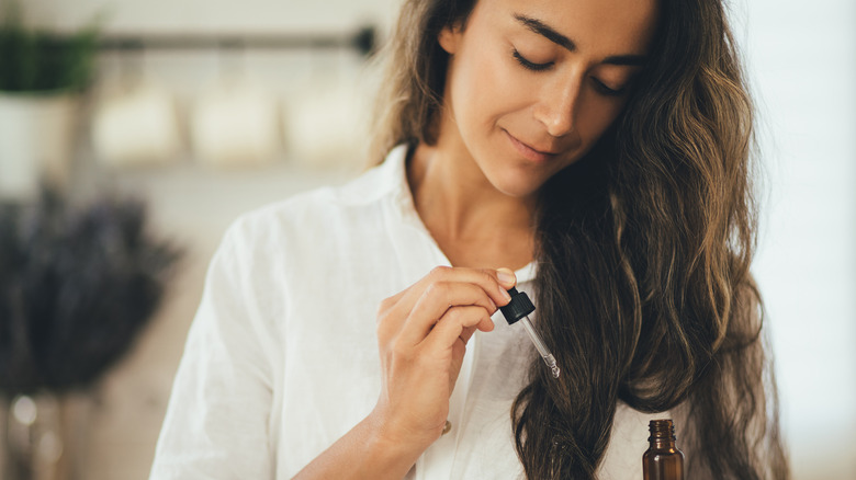 woman using hair products