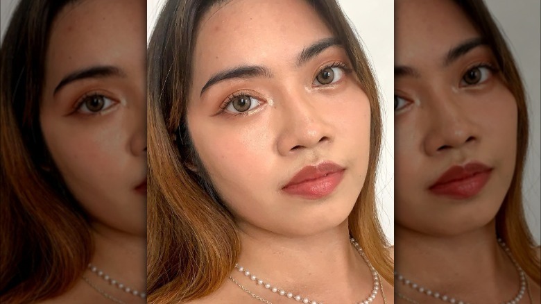 A woman with highlight under eyes