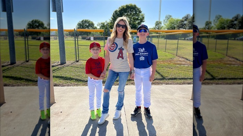 Woman wearing a baseball jersey with sneakers