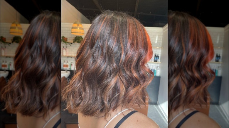 A woman with copper highlights