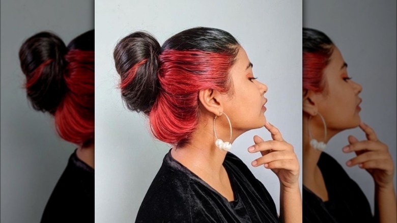 A woman with red underdye