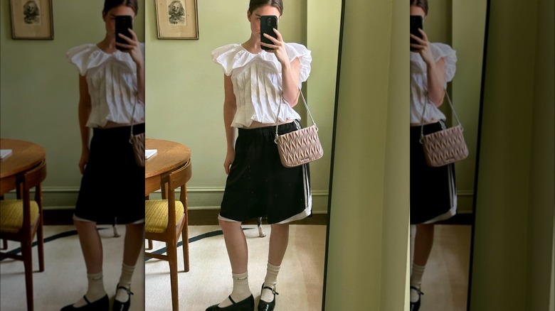 Woman in basketball shorts, Mary Janes, socks