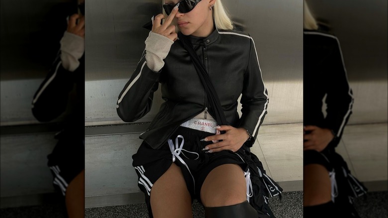 Woman wearing bow-adorned basketball shorts