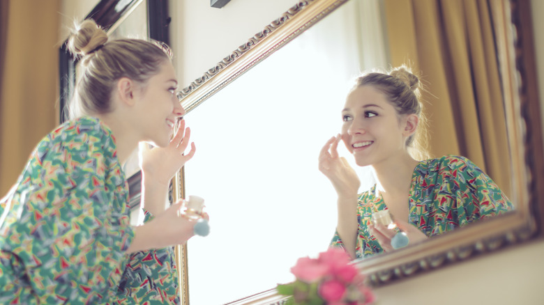 A woman applying makeup