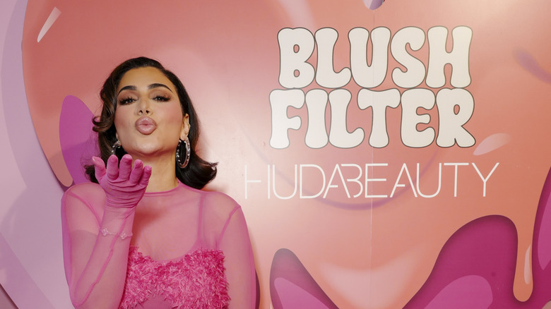 Huda Kattan sheer pink dress