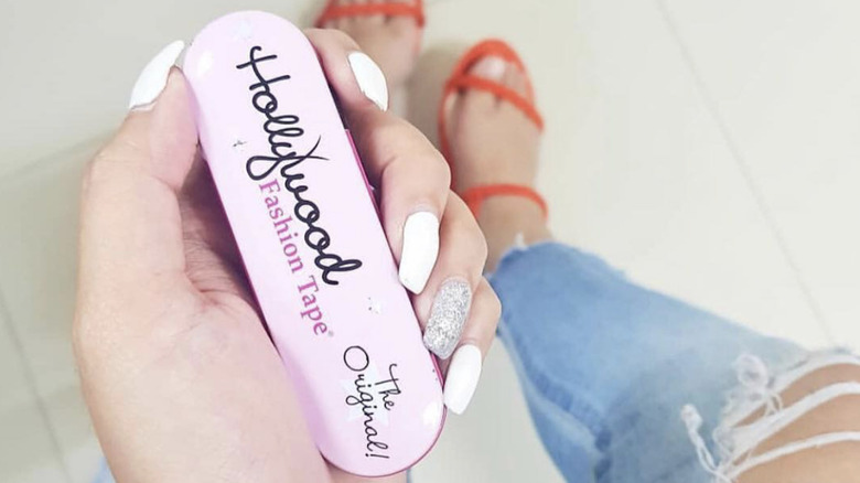 person holding Hollywood Fashion Tape 