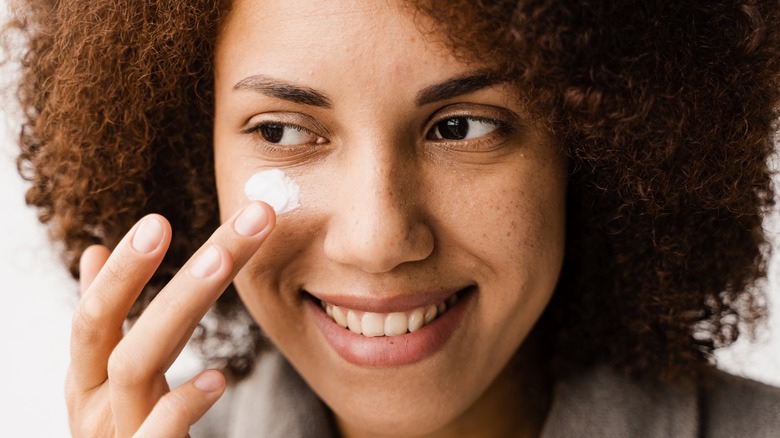 Woman applying beef tallow