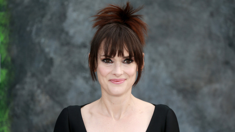 Winona Ryder smiling at the UK Premiere of "Beetlejuice Beetlejuice" in 2024