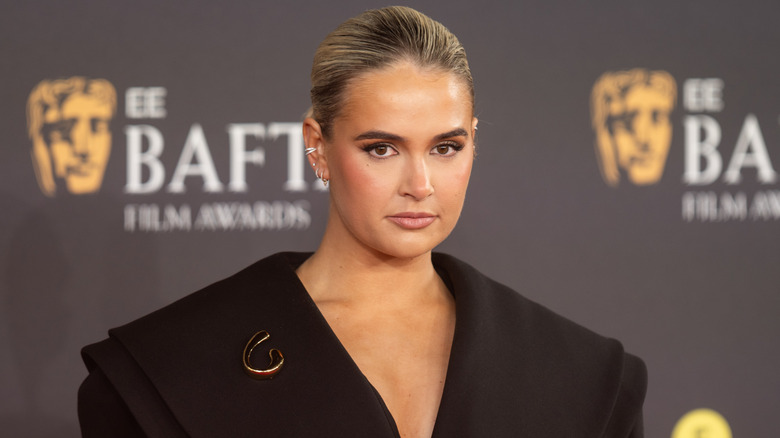 Molly-Mae Hague posing in a black jacket