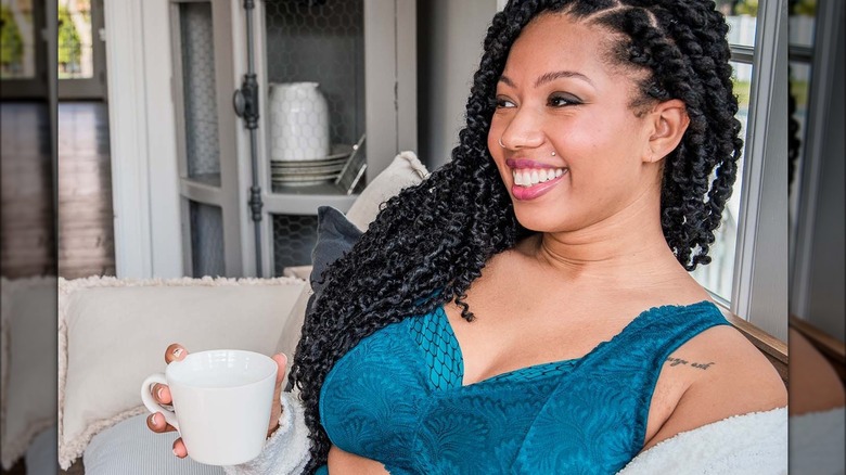 Model wearing Behave Bras in Scaled Green