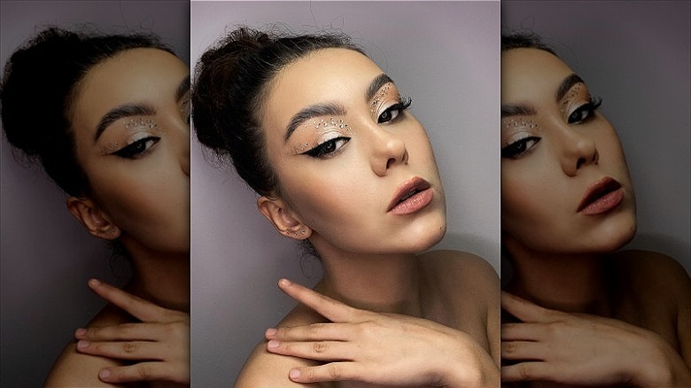 woman with jewels on eyelid