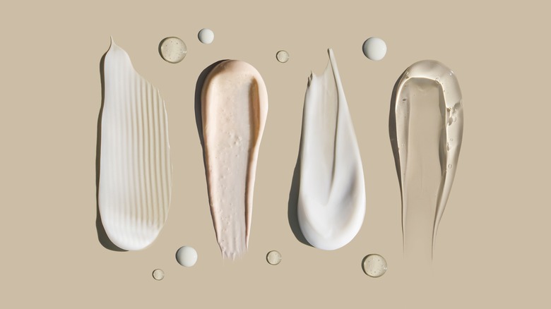 cosmetic cream smears on background