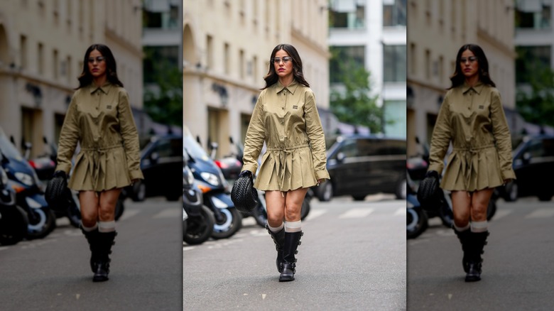 woman wearing black buckled boots