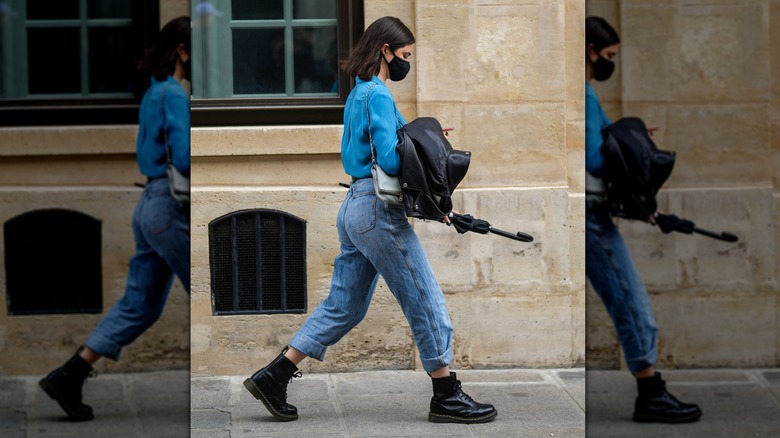 woman wearing black leather boots
