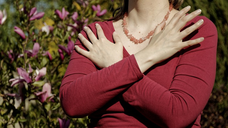 Woman doing butterfly hug