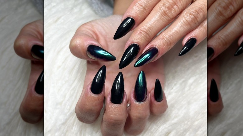 fingers with black chrome nails