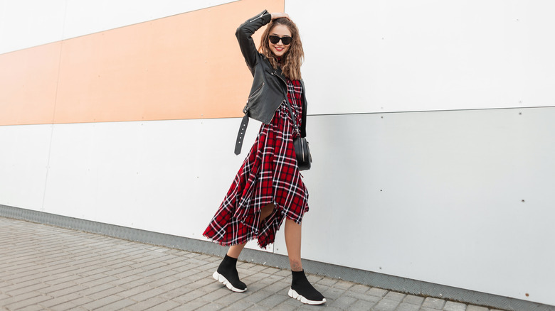 Woman wearing plaid grunge dress