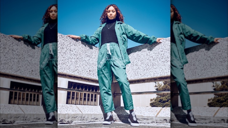 Woman posing in matching green streetwear