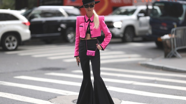 Girl wearing black and pink outfit