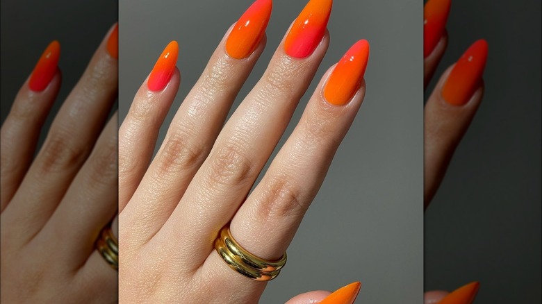 Woman with orange nails